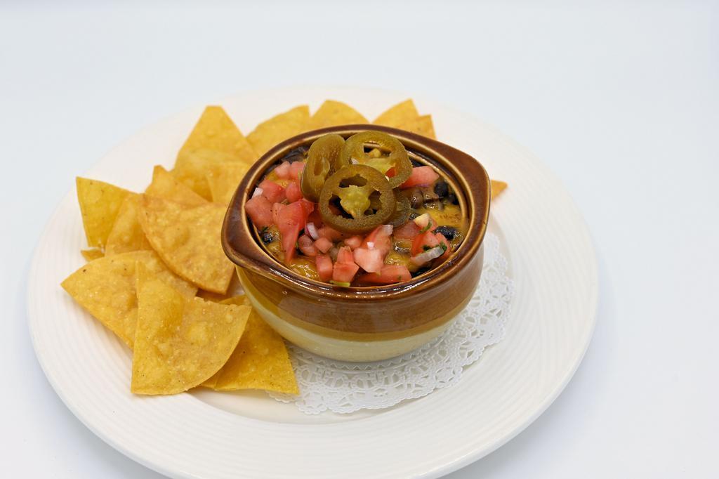 Black Bean Chili · Our homemade vegetarian chili with black beans, corn, onion and garlic in a spicy southwestern broth, topped with onions, tomatoes, jalapenos, and cheese.