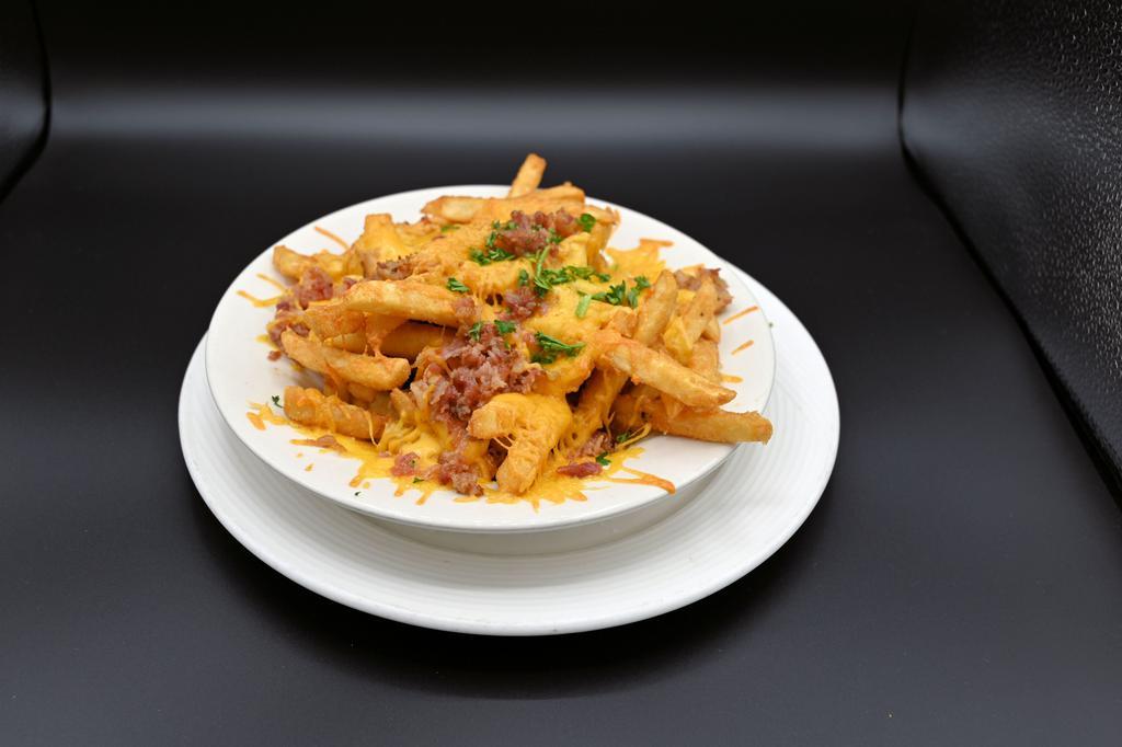 Cheese Fries · A generous portion of our coated fries topped with melted cheese and bacon served with ranch.