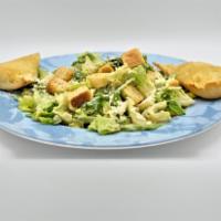 Caesar Salad · Hearts of romaine with Caesar dressing, Parmesan cheese, and garlic croutons.