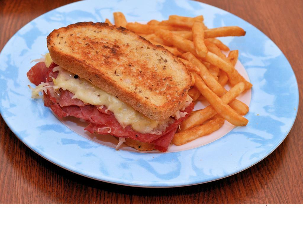 Reuben · Sliced corned beef, topped with sauerkraut, melted Swiss cheese and thousand island dressing on thick rye bread.