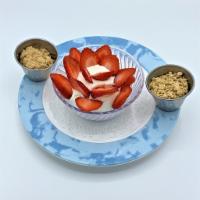 Greek Yogurt · Strained Greek yogurt with fresh strawberries and granola.