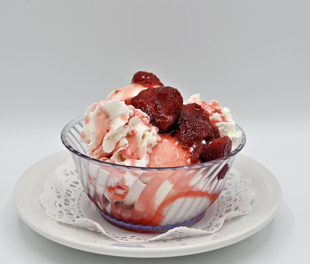 Ice Cream Sundae · Vanilla ice cream topped with chocolate or strawberry sauce and homemade whipped cream.