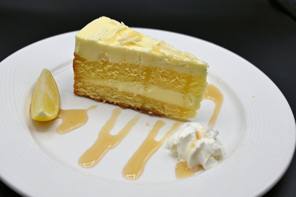 Limoncello Cake · Limoncello-mascarpone cake with lemon glaze and homemade whipped cream.