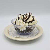 Mud Alley · A  warm homemade brownie topped with vanilla ice cream and smothered with chocolate syrup an...