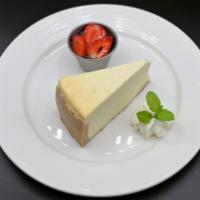 Steakhouse Cheesecake · Served with strawberry sauce and whipped cream.