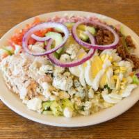 Simi Valley Cobb Salad · Diced fresh turkey, tomato, bacon, ham, hard boiled egg, crumbled blue cheese, avocado and s...