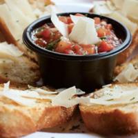 Bruschetta · Crispy garlic bread topped with a mixture of fresh diced tomatoes, balsamic vinaigrette, bas...