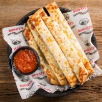 Cheesy Bread Stiks · Breadsticks topped with garlic butter and mozzarella cheese and served with a side of marina...