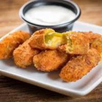 Jalepeno Poppers · Filled with cheddar cheese and served with a side of ranch dressing.