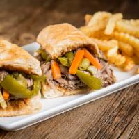Italian Beef Sandwich · Sliced thin and piled high on Italian bread. Prepared fresh and served with a side salad or ...