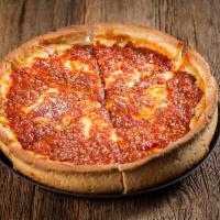 Chicago-Style Deep Dish Pizza · Chicago’s famous deep dish is a buttery crust filled with mounds of mozzarella cheese and to...