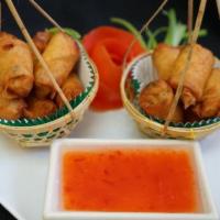 Spring Rolls · Rolls filled with Minced chicken, black mushrooms, glass
noodles, carrots, green onion and c...