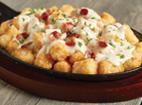 Loaded Tots · NEW! Loaded Tots 
Crispy tater tots topped with poblano cheese sauce, applewood smoked baco...