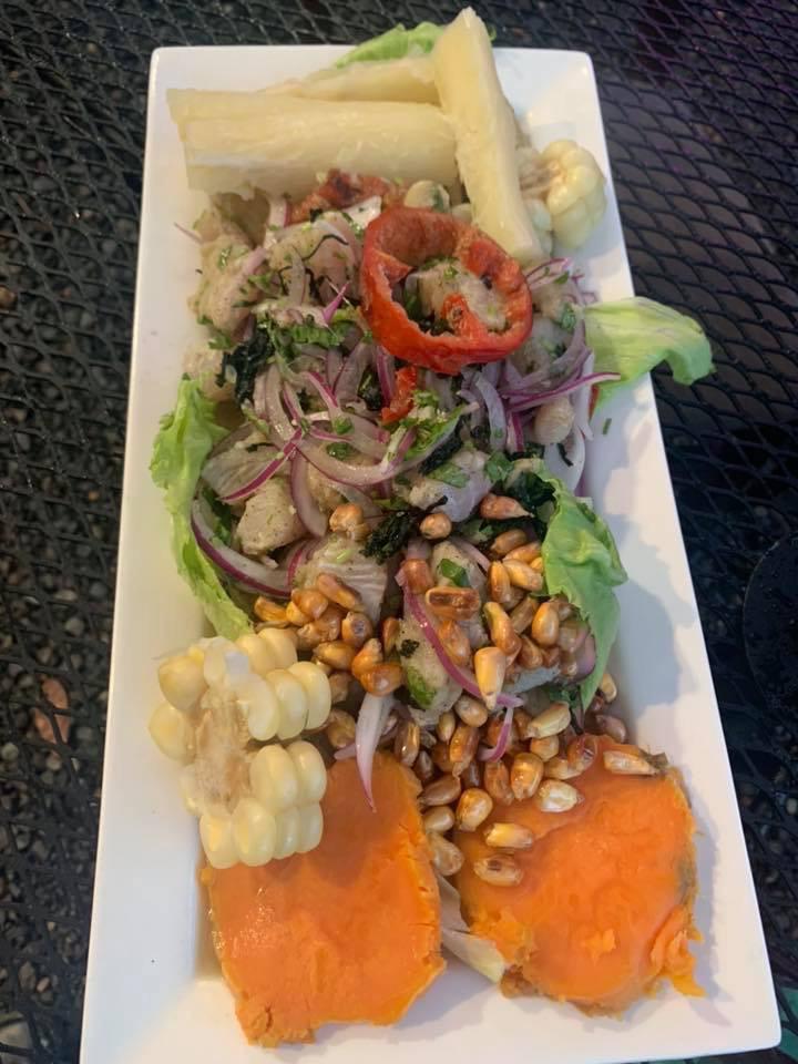 Ceviche de Pescado · Fresh fish of the day marinated with lemon juice and Peruvian spices, served with sweet potatoes, Peruvian corn, red onions, and corn nuts.