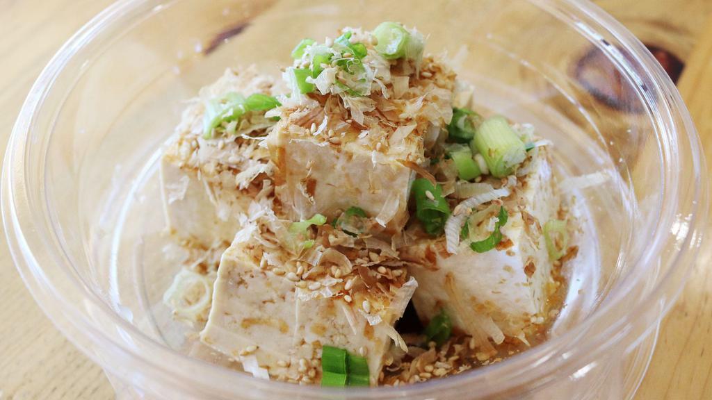 Hiyayakko · Cold tofu, soy sauce, sesame oil, sesame seed, fish flakes and green onion.