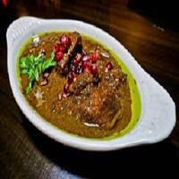 ST1. Fesenjan · Chicken stew. Chicken breast sauteed in puree of sweet and sour pomegranate sauce, saffron, ...