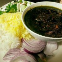 ST2. Ghormeh Sabzi · Chunks of beef sauteed with fresh green herbs, red kidney beans, and sundried limes, Persian...
