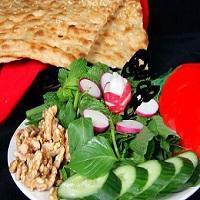 V2. Vegan Sabzi Plate · Fresh Seasonal herbs, sliced tomatoes, cucumbers, onions, olives and walnuts; served with br...