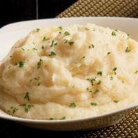 Garlic Mashed Potatoes · Idaho potatoes that are peeled, diced and steamed
Mashed with heavy cream, butter, salt, whi...
