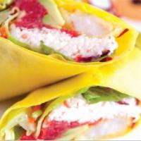 Sushi Burrito · Imitation crab, spicy tuna, avocado, tempura shrimp, and spring mix wrapped in soy paper.