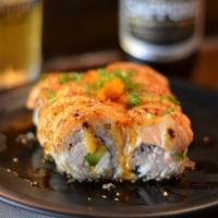 Baked Salmon Roll · Crab meat avocado, cream cheese topped with baked salmon, baked sauce and eel sauce.