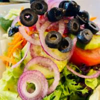 House Mixed Salad · Mixed greens with tomatoes, cucumbers, olives, red onions and carrots.