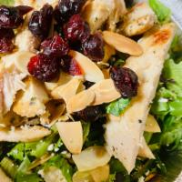 Fancy Salad · Spring mix topped with almonds, feta cheese, dried cranberries, and grilled chicken served w...