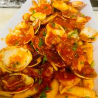 Red Clam Sauce  · Served over pasta with a small salad. 