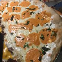 Vodka Sauce Pizza · Homemade vodka pink cream sauce and mozzarella.