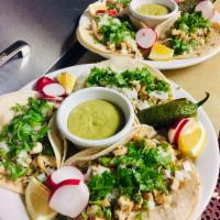 Pollo Asado Tacos (3) · Grilled chicken. Soft corn tortillas served with cilantro, onions and salsa.