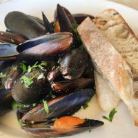 Drunken Mussels · Gorgonzola white wine broth and toasted baguette.
