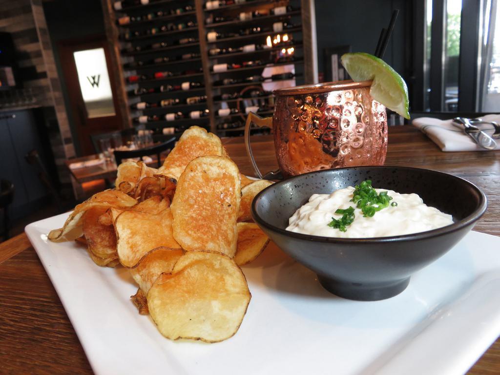 Housemade French Onion Dip · Caramelized onions, garlic , and house made chips.