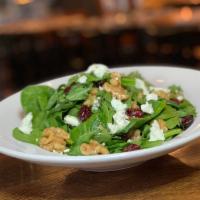 Goat in the Garden Salad · Baby arugula, spinach leaves, dried cranberries, candied walnuts, goat cheese, red wine, and...