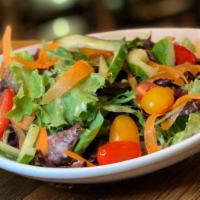 House Salad · Mixed greens, cucumbers, shaved carrots, and heirloom cherry tomato.