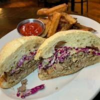 Pulled Jerk Chicken · red cabbage slaw, pickles on stirato roll