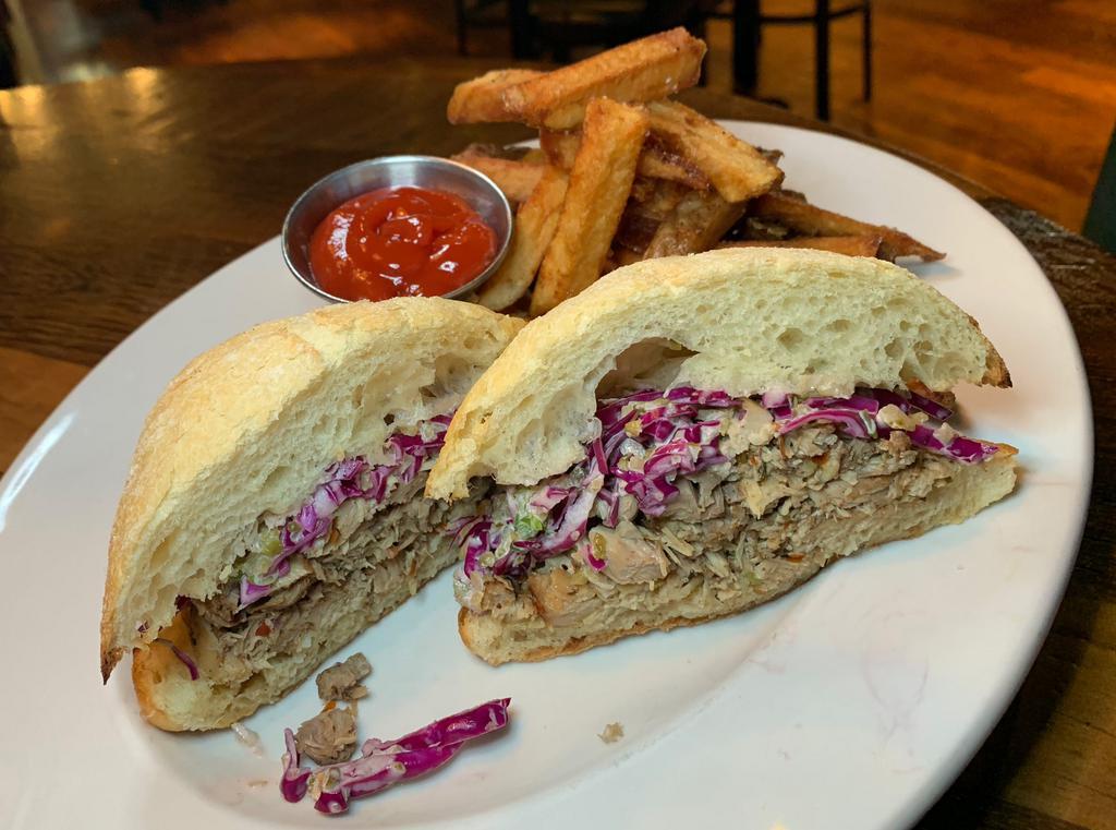 Pulled Jerk Chicken · red cabbage slaw, pickles on stirato roll