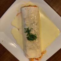 Burrito Mexicano  · 1 beef or chicken fajita burrito topped with cheese sauce and burrito sauce. Served with gua...