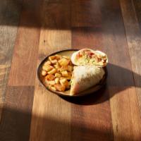 Breakfast Burrito · Scrambled eggs, salsa, avocado and Swiss cheese wrapped in a flour tortilla, served with bre...