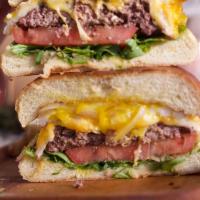G's Famous Burger · 1/2 lb burger, cheese blend, fried egg, with lettuce, tomato, caramelized onion and G's spec...