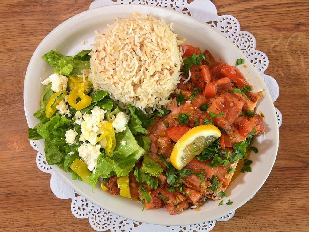 Salmon Fillet · Fillet of salmon marinated in a special blend of seasoning and topped with ginger tomato sauce. Served with rice and vegetables or choice of salad.