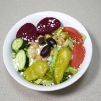 Leo's Famous Greek Salad · Comes with lettuce, tomato, cucumber slices, pepperoncini, Greek olives, beets, chickpeas, f...