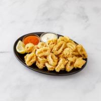 Fried Calamari · Served with North African spicy tomato sauce and tartar sauce.