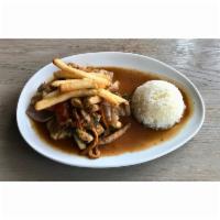 Pollo Saltado · wok seared chicken, soy and oyster sauce, onions, tomato petals, jasmine rice, fries