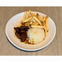 Kid Lomito Saltado · Beef tenderloin stir-fry, rice with Peruvian corn, soy & oyster sauce. Served with French fr...