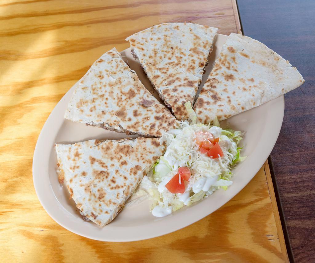 18. Quesadilla · Grilled flour tortilla with cheese and a choice of meat. Garnished with lettuce and tomato.