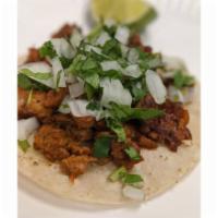 Al Pastor Street tacos · 4.5'' corn tortilla filled with Pastor meat (marinated pork) , salsas, guacamole sauce, and ...