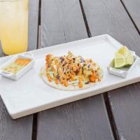 Fish Tacos · Beer battered cod in a corn tortilla, topped with our slaw and choice of chipotle aioli or c...