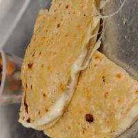 Corn quesadilla · 2 Corn tortillas filled with our Mexican blend of cheese, comes with choice of salsa and avo...