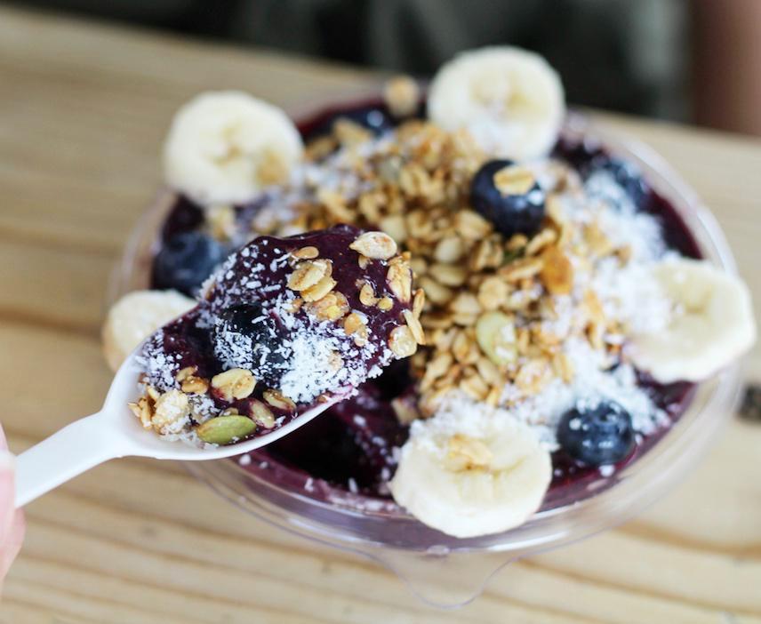 Heartbeet Bowl · Acai berry, bananas, blueberries, beetroot powder, local date puree and almond milk. Topped with house-made gluten-free granola, bananas, blueberries and coconut flakes.