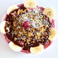 Decadant Dragon Bowl · Pitaya, bananas, almond butter, raw cacao, local date puree and almond milk. Topped with our...